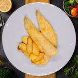 Filete de merluza a la romana con patata panadera